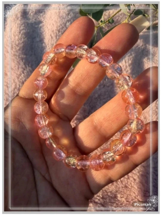 Elastieke armband met roze/gele transparante kralen – photo 2